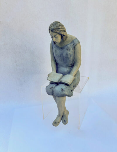 Sculpture by by Victoria B.C. Artist, Louise Monfette titled The Reader